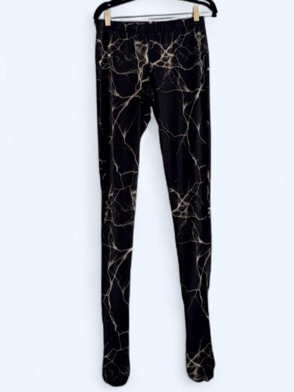 Vetements AW21 runway lightning-print footed leggings, as seen layered beneath t